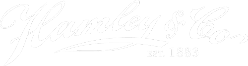 Hamley Logo - White script type with serif type below